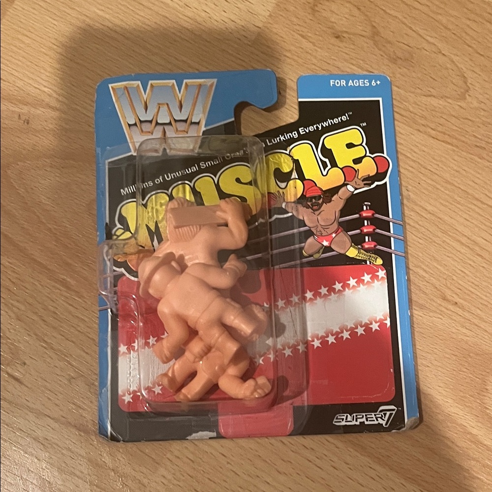 WWE M.U.S.C.L.E. Figures in Blue and Red Packaging